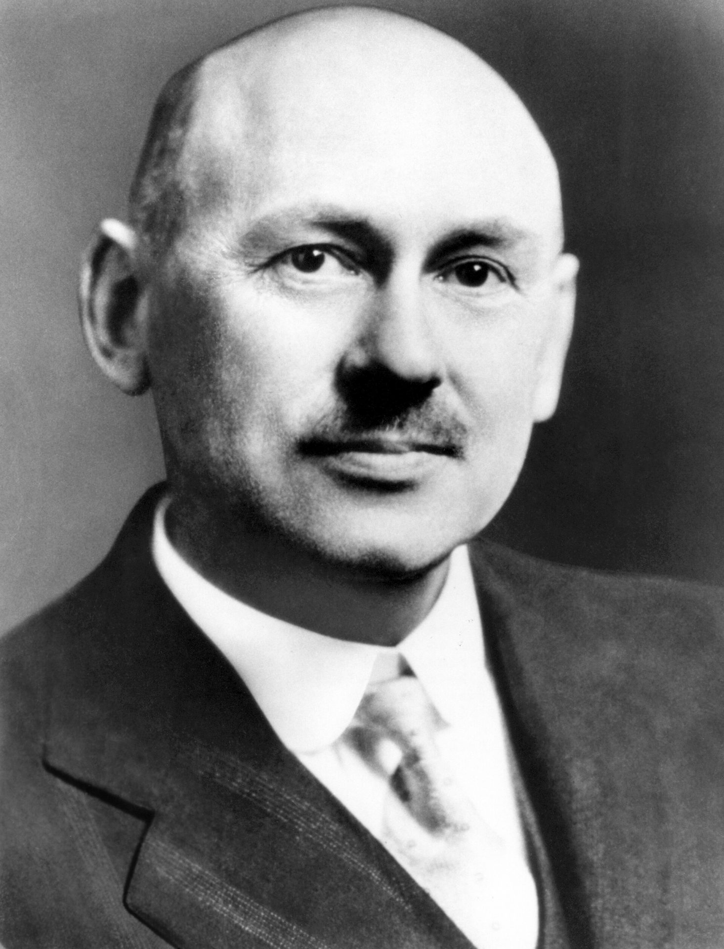 Robert H. Goddard beside one of his rockets